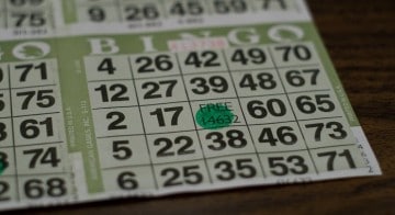 A bingo card is shown upon a table