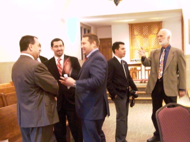 Local official talk following the 9/11 ceremony at Holy Child on Sept. 11, 2016.