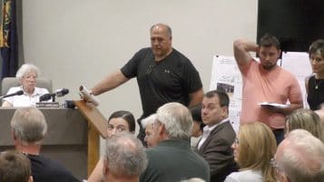 Former councilman Mike Chiodo and former mayor Pat DeBlasio Jr. look on as a resident speaks during the July 9, 2018 council meeting.