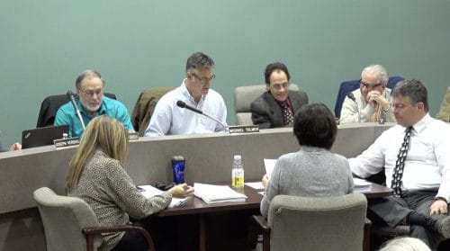 bridgeville borough solicitor thomas mcdermott talks to councilman nino petrocelli sr at the december 2018 borough council meeting